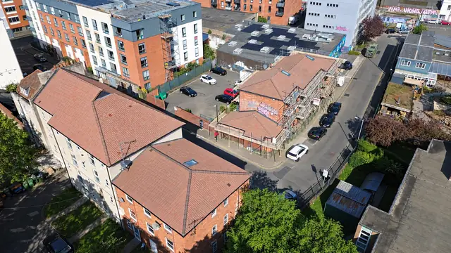 Aerial view of re-roofed apartment blocks in an urban setting
