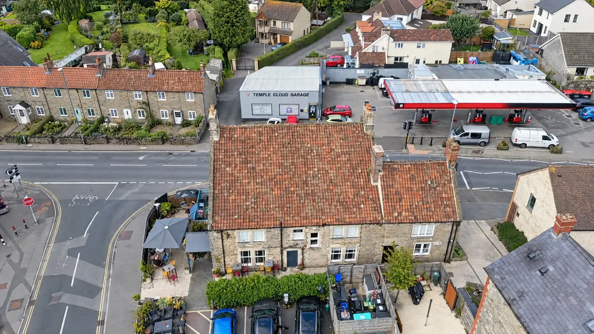Aerial view of a clay pantile roof on a stone building in Temple Cloud